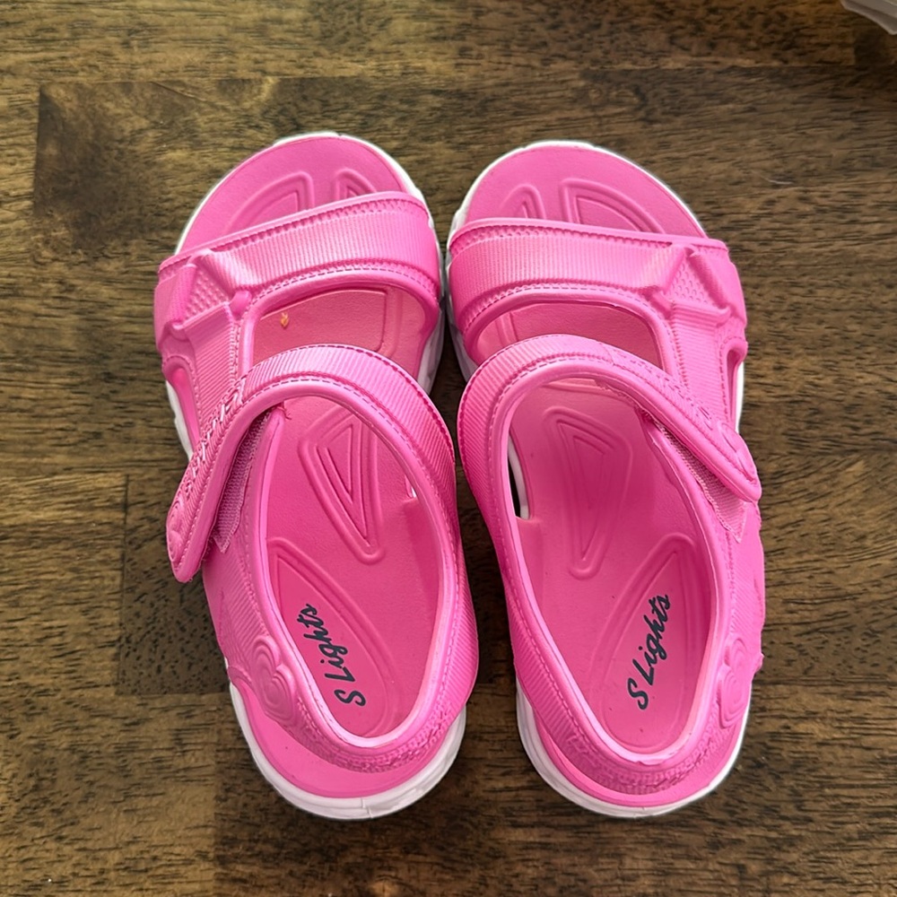 Sketchers pink light up sandals. One of these things my kid just HAD to have? 🤣